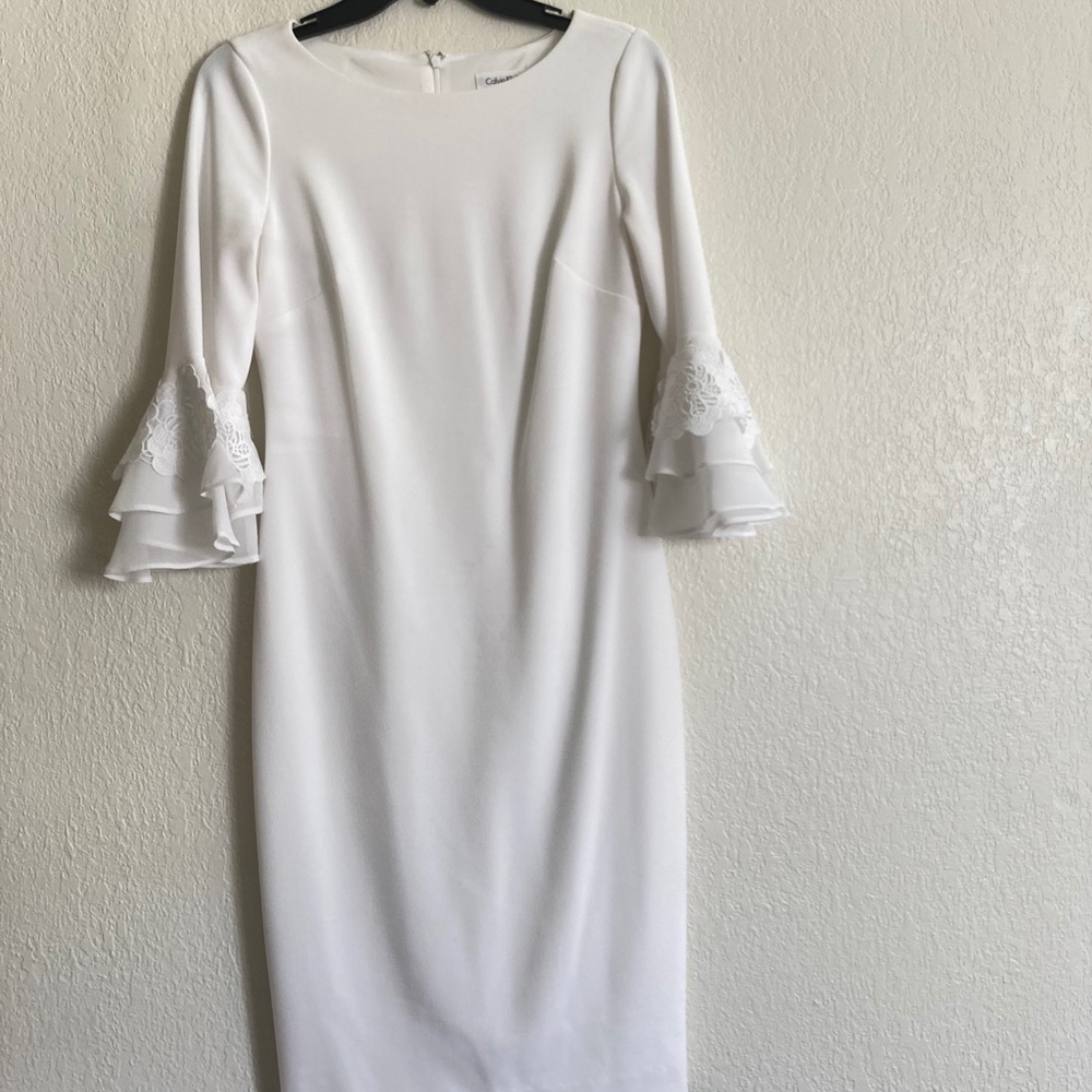 Gorgeous white flare sleeve dress. Bridal shower